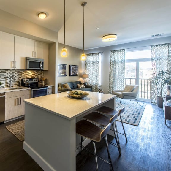 a kitchen with stainless steel appliances and a counter top