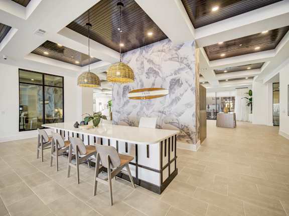 a workout room with weights and cardio equipment in a home gym