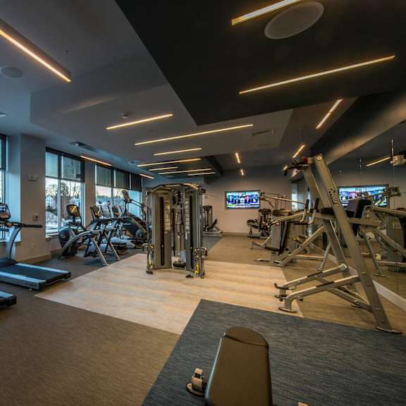 Fitness center with cardio machines at RE150 luxury apartments in Medford, MA