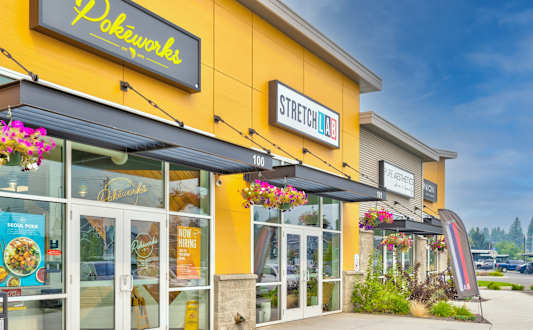 A yellow building with a sign that says Pokworks.