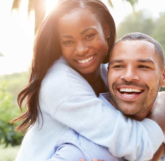a man giving a woman a piggyback ride