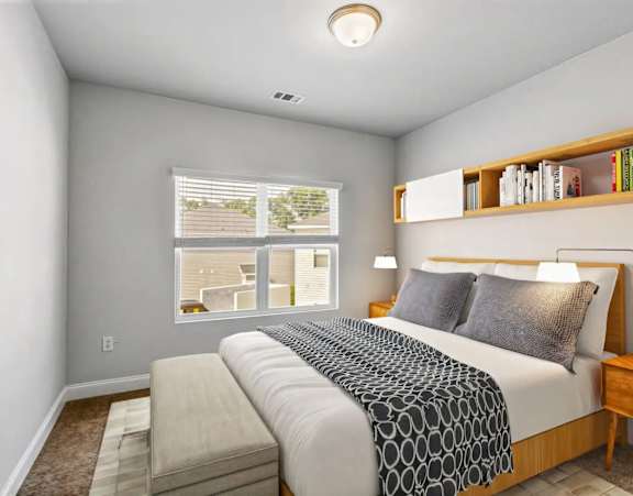 a renovated kitchen with white cabinets and black appliances at Uphill Flats, Decatur, GA