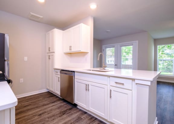 Kitchen with Custom, White Cabinetry at Saw Mill Village Apartments, Columbus, OH, 43235