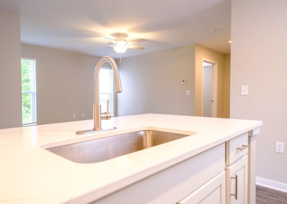 Kitchen with Gleaming Quartz Countertops at Saw Mill Village Apartments, Columbus, OH