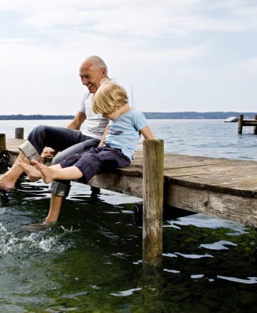 Families play on the lake at Lakestone Terrace Senior Living