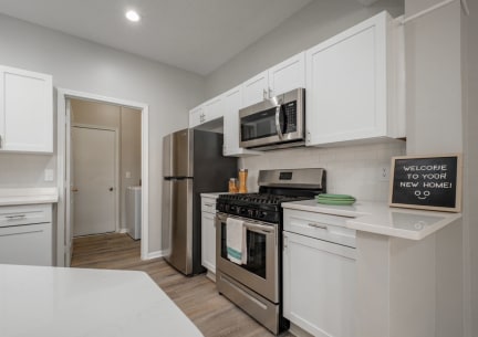Kensington Grove apartments with with cabinets and stainless appliances