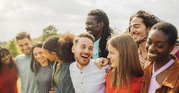A group of people standing together outdoors.