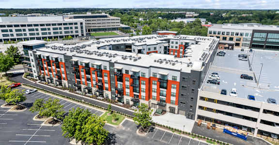 an aerial view of a large building with orange doors at Tapestry West in Richmond, Virginia 23230