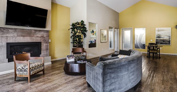 a living room with a couch and a fireplace