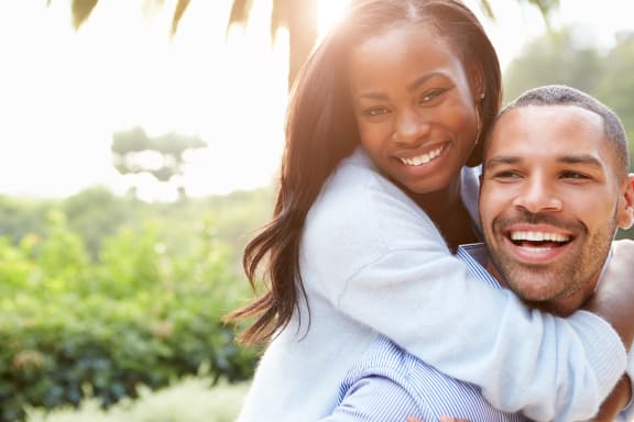 a man giving a woman a piggyback ride