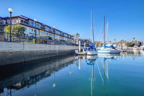 boats are docked at a marina next to a building at Marina Harbor, Marina del Rey, CA, 90292