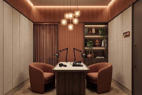 A cozy room with a table, chairs, and a microphone setup.