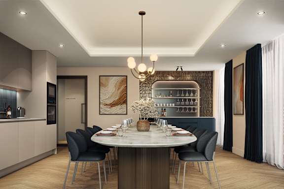 A modern dining room with a round table and chairs.