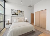 Thumbnail 5 of 17 - a bedroom with a large bed in a 555 waverly unit