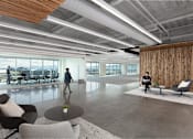 Thumbnail 12 of 12 - A modern office space with a person walking in the foreground.