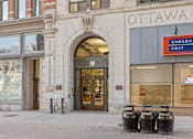 Thumbnail 2 of 7 - The front of a building with a sign that says Canada Post.