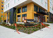 Thumbnail 11 of 16 - A building with a sign that says CopperLeaf in front of it.