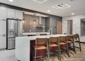 Thumbnail 8 of 31 - community kitchen with bar seating