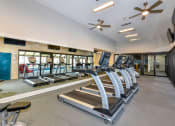 Thumbnail 15 of 25 - Fitness center with cardio equipment at Waterford Place, Louisville, Kentucky