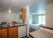 Thumbnail 4 of 32 - Farr Court Apartments Kitchen Counter and Living Room