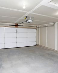 a white garage with a white door and white walls