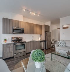 a kitchen and living room in a 555 waverly unit