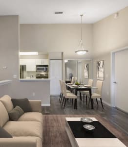 a living room and dining room with a couch and a table