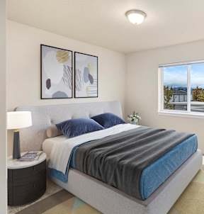 A bedroom with a large bed and a window overlooking a cityscape.