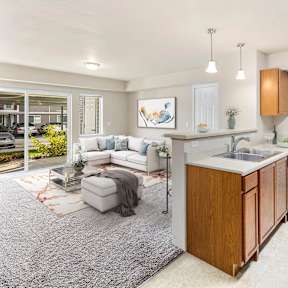 A modern kitchen with wooden cabinets and a white countertop.