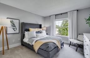 Carpeted Bedroom With Large Windows