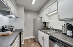 Kitchen With White Cabinetry & Stainless Steel Appliances