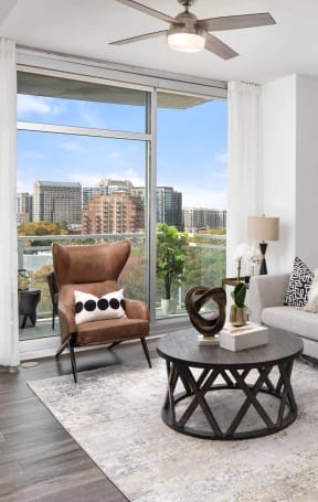 an open living room with a view of the city