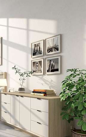 A bedroom with a bed, desk, and a large window.