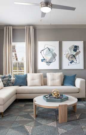 a living room and dining room with a couch and a table