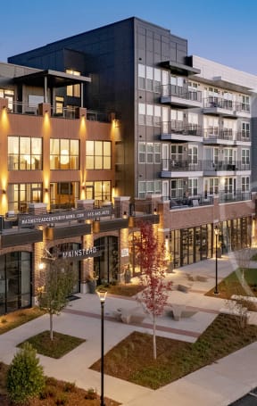 a rendering of a building with a river in the background