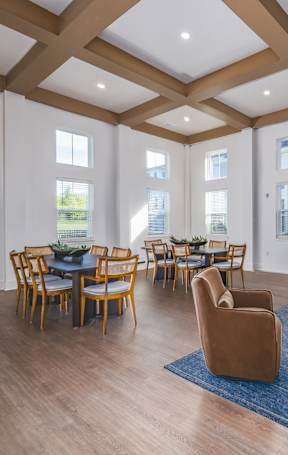A large room with wooden floors and furniture.