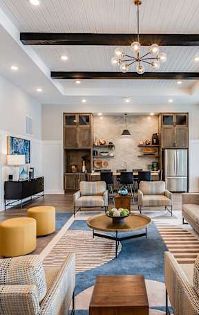 a living room and dining room with a couch and a table