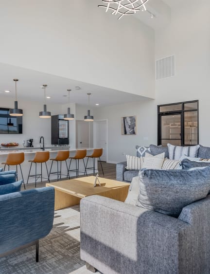 a living room with candles on a coffee table and a white couch