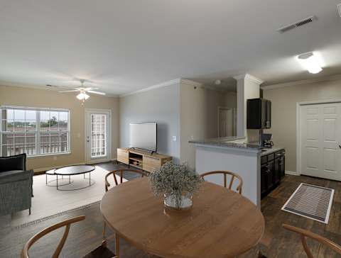 Spacious Living Area With Wood-Style Flooring