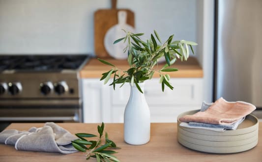 White Vase and Plates on Counter in Kitchen