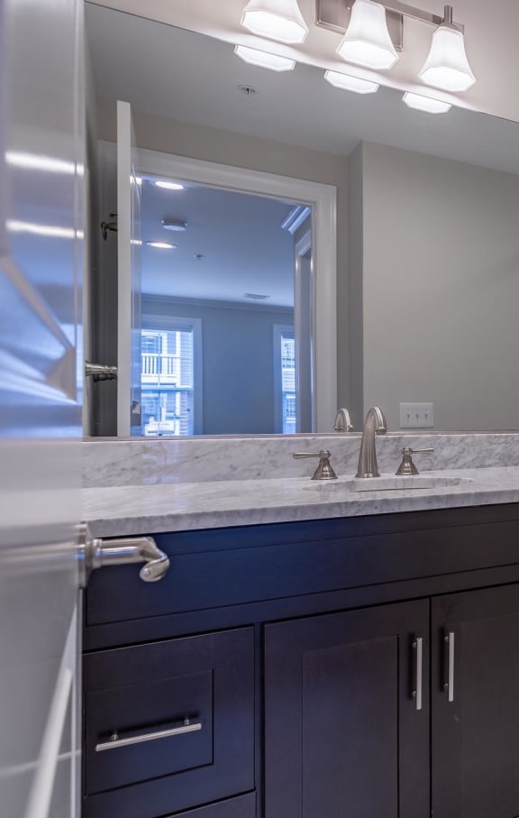 a bathroom with a toilet sink and shower at Zephyr Ridge Apartment Homes, Cedar Grove, New Jersey, 07009