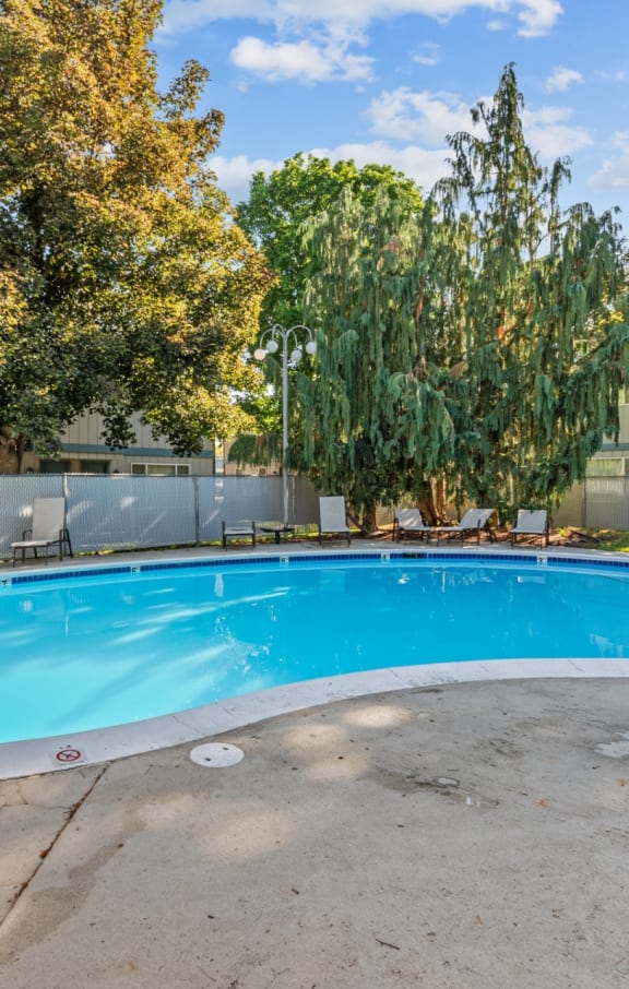 Curtis Meadow Apartments in Boise, Idaho Pool with Lounge Chairs