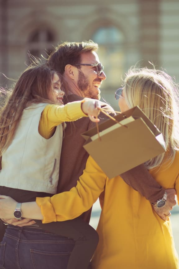 Family Smiling while Shopping Together