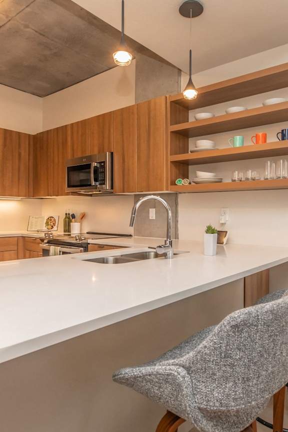 The Benedictine Apartments in Tucson, Arizona Model Kitchen with Built-In Shelving