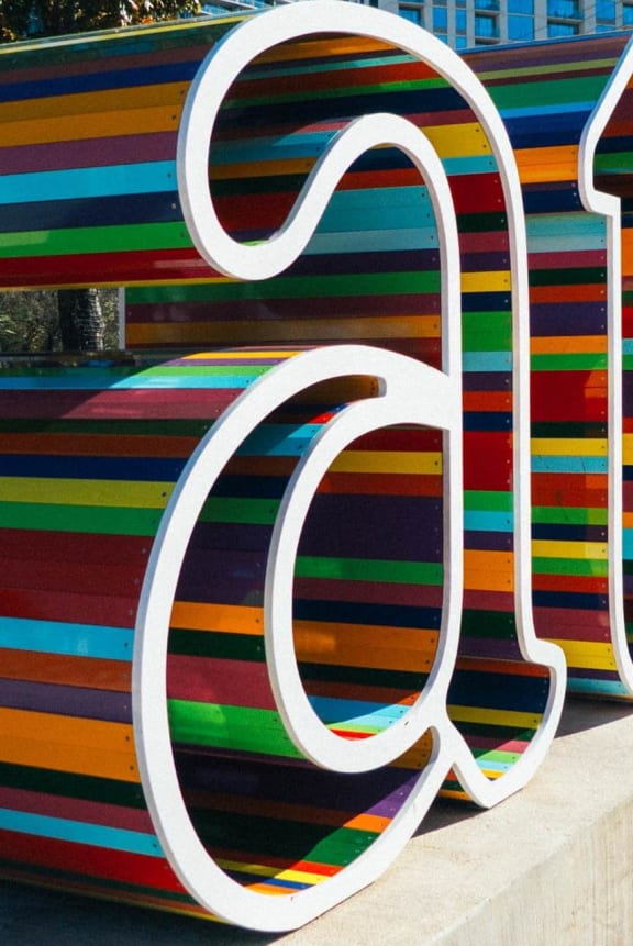 a large colorful sculpture with the word gucci on it