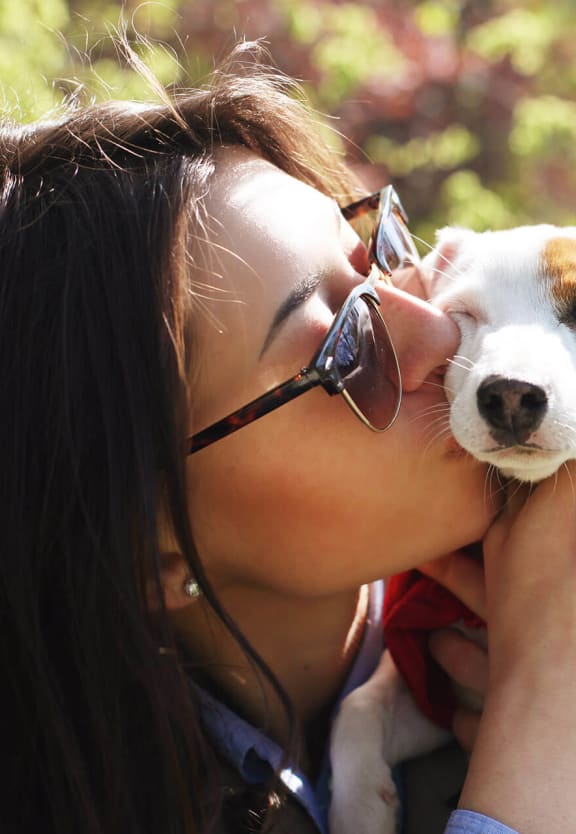 Woman and Cute Pet in the Park