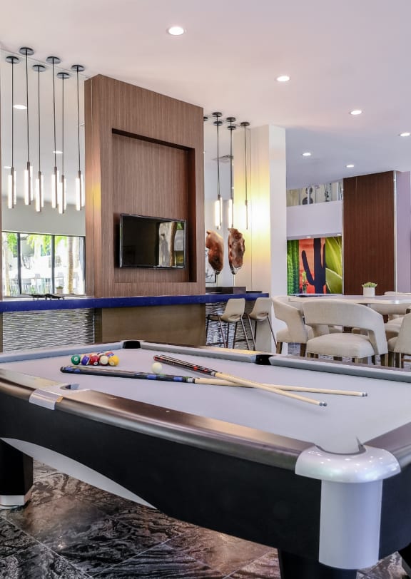 resort-inspired, covered lounging area and swimming pool at Avora apartments