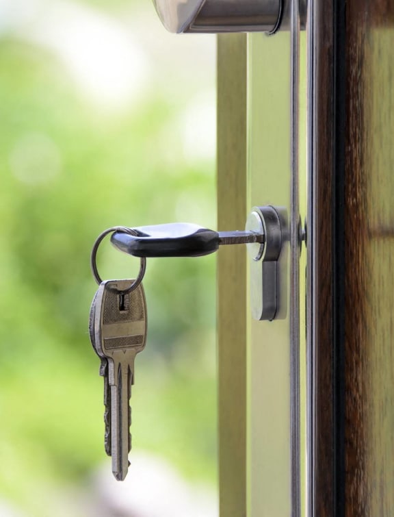 a door handle with keys hanging out of it