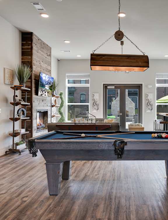 a pool table in a game room in a house