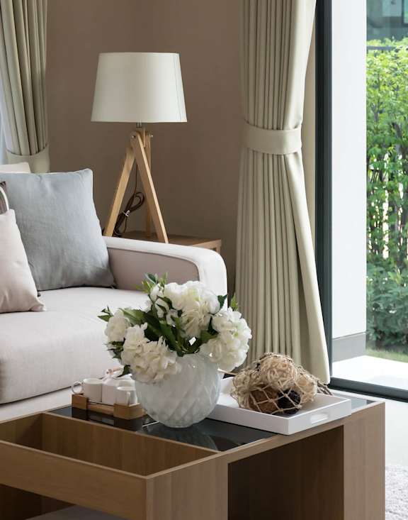 a living room with a white couch and a coffee table